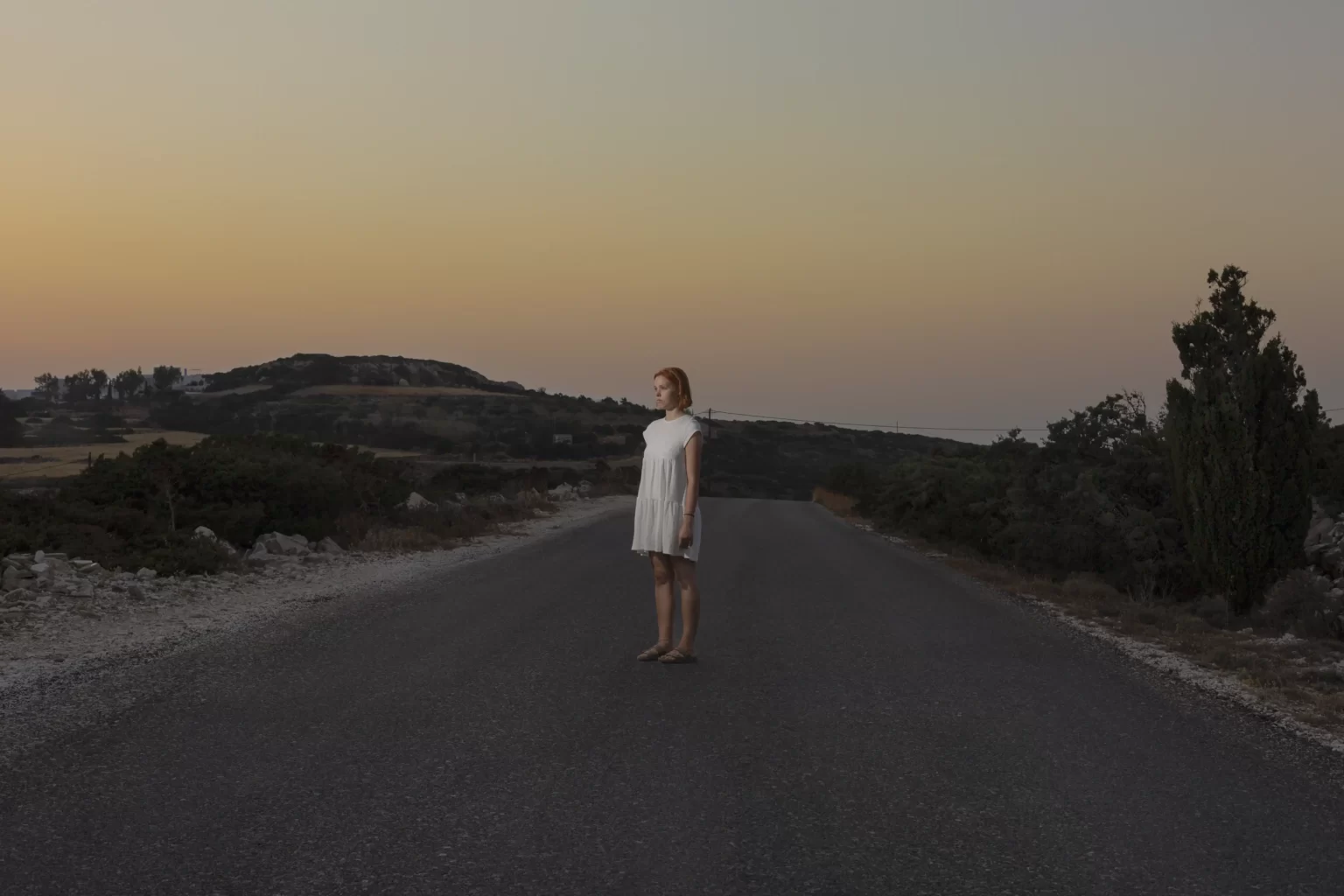 Photoshooting a woman in the streets of Paros.